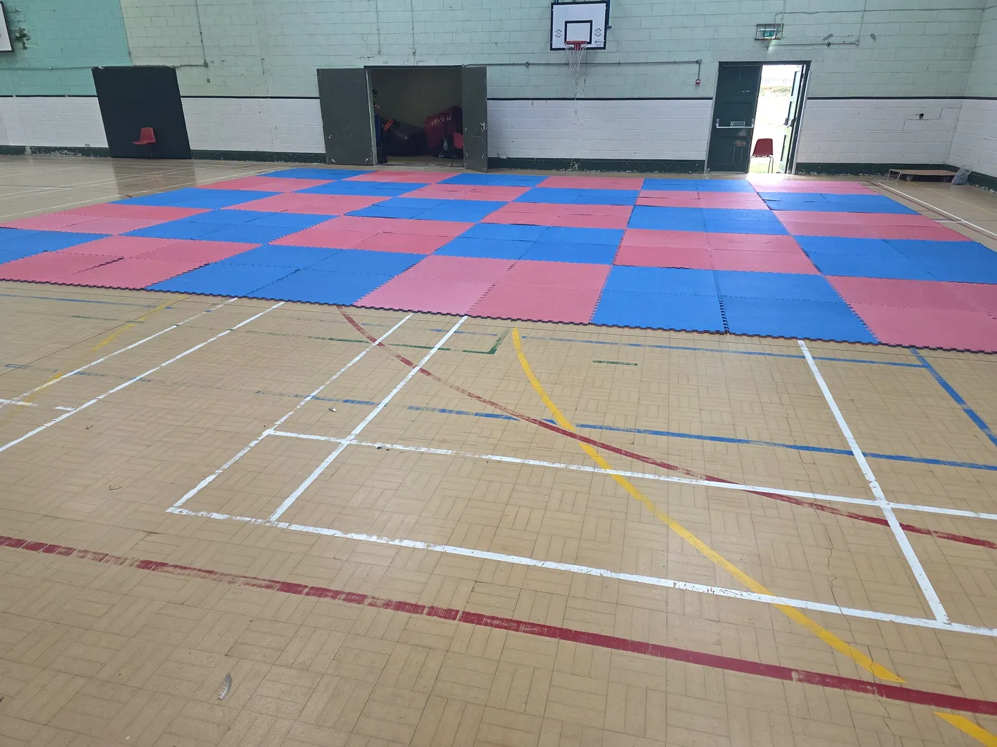 Leinster TaeKwon Do training hall in Arklow with red and blue mats laid out for class